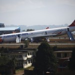 A Turkish Airlines plane lies on the field after it overshot the runway at Tribhuvan International Airport in Kathmandu