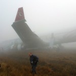 Passengers exit from a Turkish Airlines plane soon after it overshot from the runway in Kathmandu
