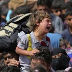 A child cries as displaced Sunni people fleeing the violence in the city of Ramadi, arrive at the outskirts of Baghdad