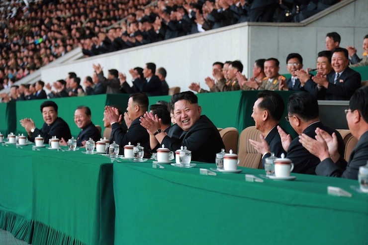 Handout photo of North Korean leader Kim Jong Un watching a men's football match at Kim Il Sung Stadium