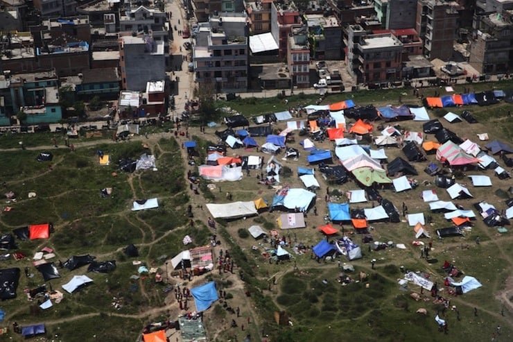 Tents are set up in an open area near multi-storey buildings following an earthquake in Kathmandu, Nepal in this Red Cross handout picture taken on April 27, 2015.  REUTERS/IFRC/Palani Mohan/Handout via Reuters ATTENTION EDITORS - THIS PICTURE WAS PROVIDED BY A THIRD PARTY. REUTERS IS UNABLE TO INDEPENDENTLY VERIFY THE AUTHENTICITY, CONTENT, LOCATION OR DATE OF THIS IMAGE. THIS PICTURE IS DISTRIBUTED EXACTLY AS RECEIVED BY REUTERS, AS A SERVICE TO CLIENTS. FOR EDITORIAL USE ONLY. NOT FOR SALE FOR MARKETING OR ADVERTISING CAMPAIGN. NO SALES. NO ARCHIVES.