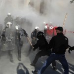 Anti-establishment protesters clash with riot police during a protest against high security prisons in Athens