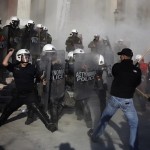 Anti-establishment protesters clash with riot police during a protest against high security prisons in Athens