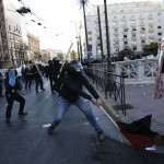 Anti-establishment protesters clash with riot police during a protest against high security prisons in Athens