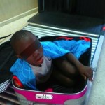 Handout photo of a boy is seen cramped inside a suitcase at the border security checkpoint between Spain's north african enclave Ceuta and Morocco