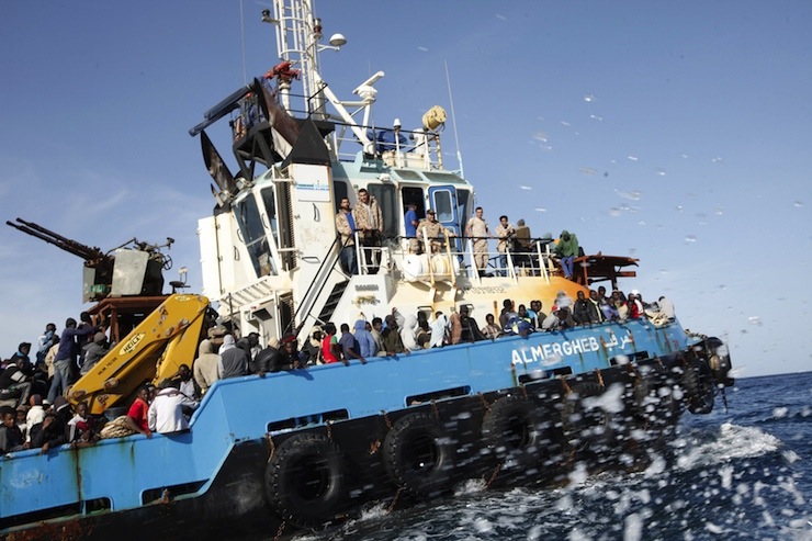 A Libyan Navy boat carries migrants back to the coastal city of Misrata