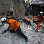 Nepalese military personnel and International rescue check on a collapsed building after earthquake in centre of Kathmandu