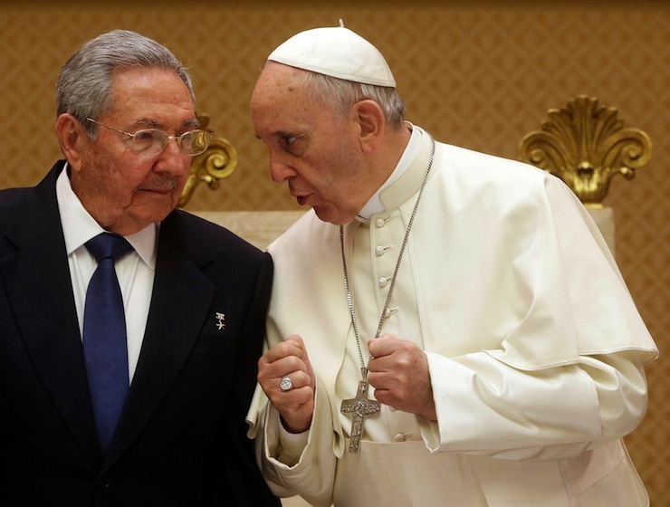 Pope Francis talks with Cuban President Raul Castro during a private audience at the Vatican