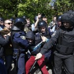 A man who tried to disrupt a May Day rally of Ukraine's Communist party supporters is detained by police in Kiev