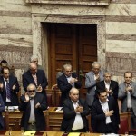 Alexis Tsipras acknowledges applause during a parliamentary session in Athens