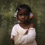 Abiba poses for a picture a day ahead of the International Day of the African Child in Abidjan