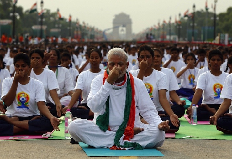 India's Prime Minister Modi performs yoga with others during a yoga camp to mark the International Day of Yoga, in New Delhi