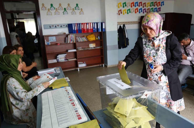 A woman casts her ballot at a polling station during the parliamentary election in Istanbul, Turkey, June 7, 2015. Turks began voting on Sunday in the closest parliamentary election in more than a decade, one that could pave the way for President Tayyip Erdogan to amass greater power or end 12 years of single-party rule for the AK Party he founded. REUTERS/Murad Sezer