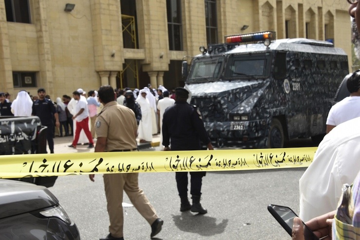 Police cordon off the Imam Sadiq Mosque after a bomb explosion following Friday prayers, in the Al Sawaber area of Kuwait City