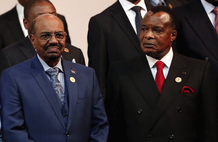 President of the Republic of the Congo Sassou Nguesso looks on next to Sudan's President Bashir as they pose for photographers ahead of the African Union summit in Johannesburg