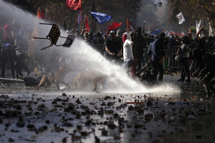 A chair is hurled at police by protesters during a demonstration to demand changes in the Chilean education system in Santiago