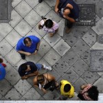 People line up at an ATM in Athens