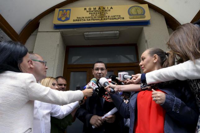 Romanian PM Ponta addressess to media as he leaves the anti-corruption agency, locally known as the DNA, in Bucharest