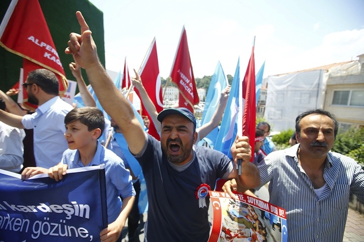 Demonstrators shout slogans during a protest against China near the Chinese Consulate in Istanbul