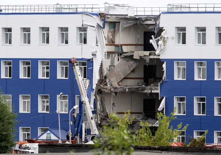 A general view of a military barracks with a collapsed wall in Omsk, Russia
