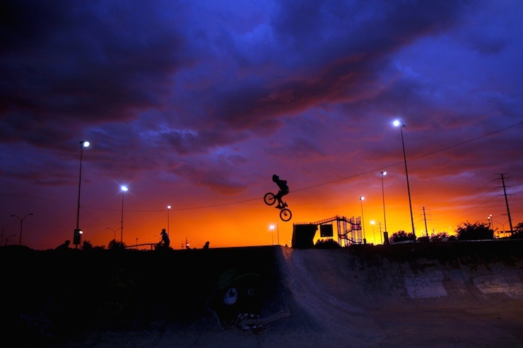 BMX rider performs a trick at a skate park in Ciudad Juarez