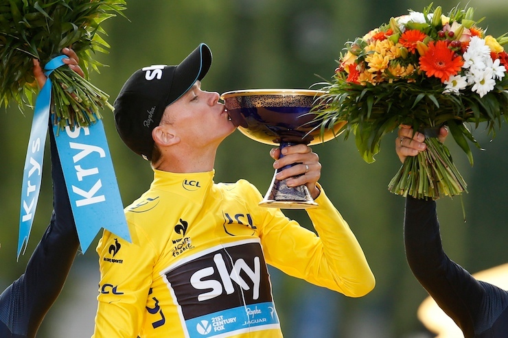 Team Sky rider Froome of Britain, the race leader's yellow jersey, celebrates his overall victory on the podium after the final 21st stage of theTour de France cycling race