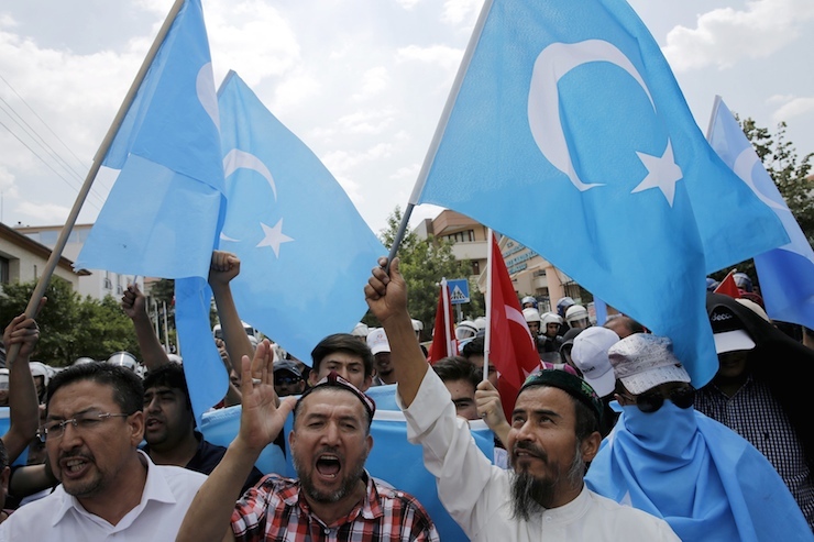 Demonstrators shout slogans as they attend a protest in front of the Thai Embassy in Ankara