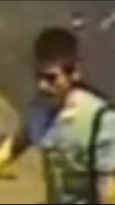 A view of a man who was seen on CCTV kicking a bag into the water near a pier on the night of August 17, 2015 in this handout image released by the Thai police