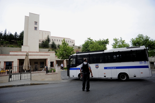 A Turkish police van arrives at the U.S. consulate building after an attack in Istanbul, Turkey