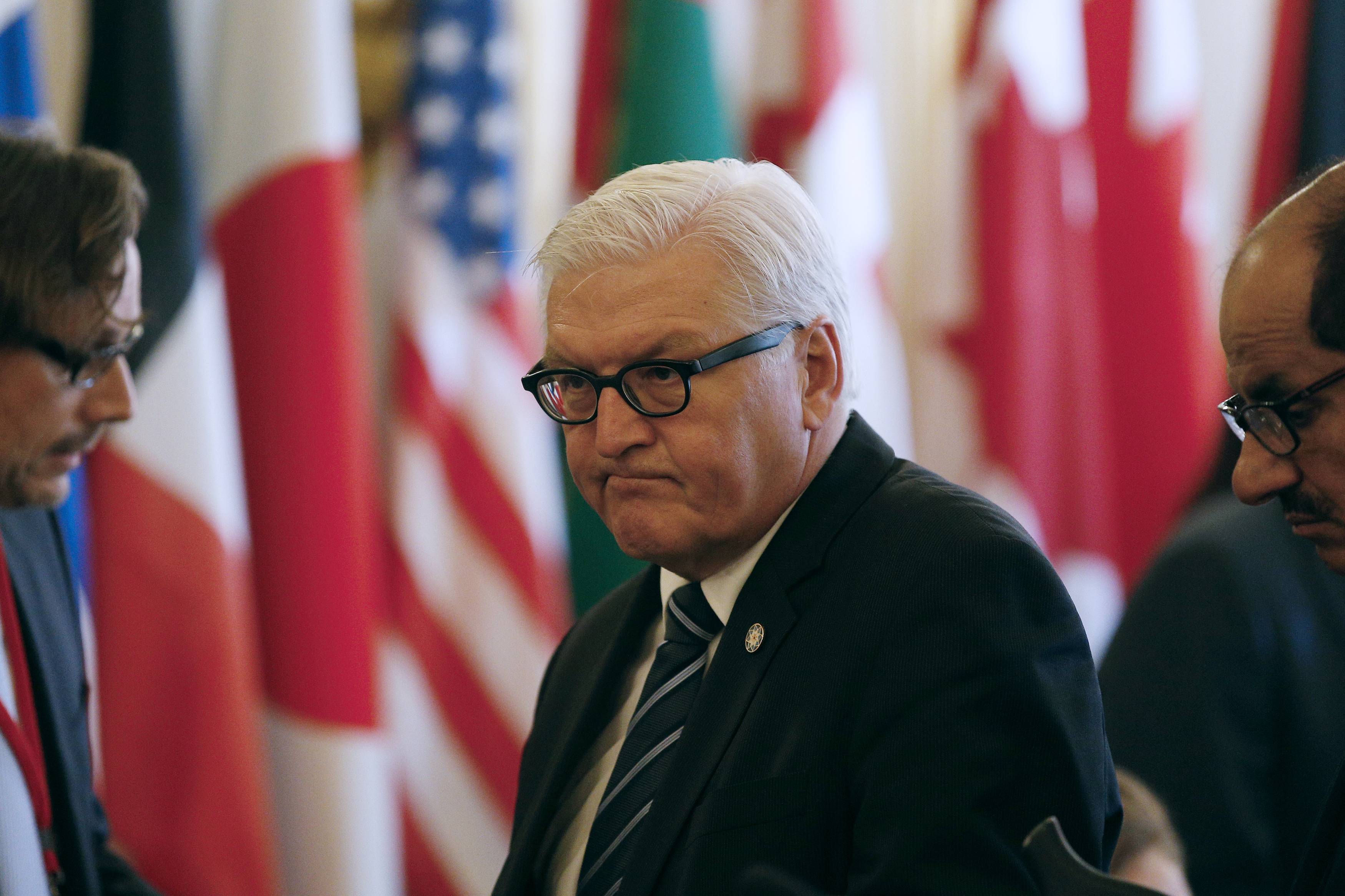 German Foreign Minister Frank-Walter Steinmeier (C) attends the International Conference on Peace and Security in Iraq, at the Quai d'Orsay in Paris September 15, 2014. French President called on Monday for a global response to counter Islamic State militants during an international conference bringing together about 30 countries to discuss how to cooperate in the fight against Islamic State militants, saying the group posed a security threat the world over. REUTERS/Yoan Valat/Pool (FRANCE - Tags: POLITICS MILITARY)