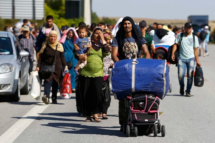 Migrants walk towards the Greece border on a road near Edirne