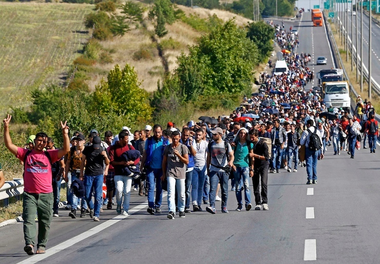 Migrants walk towards the Greek border on a highway near Edirne