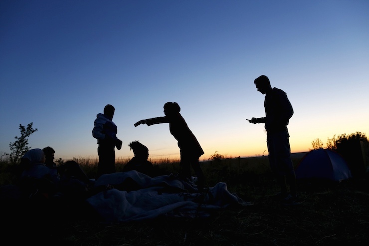 Syrian migrants stand by their sleeping bags on the side of a highway as they rest from their travel towards the Greece border near Edirne Turkey, September 16, 2015. Turkish security forces stopped hundreds of people, mainly Syrians, from marching towards western Turkey's border with Greece on Tuesday in a bid to reach Europe, potentially opening up a new front in the escalating migrant crisis. REUTERS/Osman Orsal