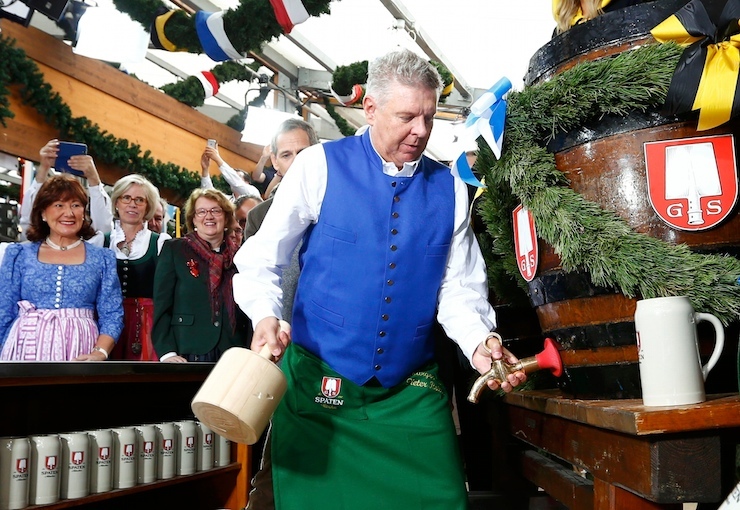 Munich mayor Reiter prepares to tap the first barrel of beer during the opening ceremony for the 182nd Oktoberfest in Munich