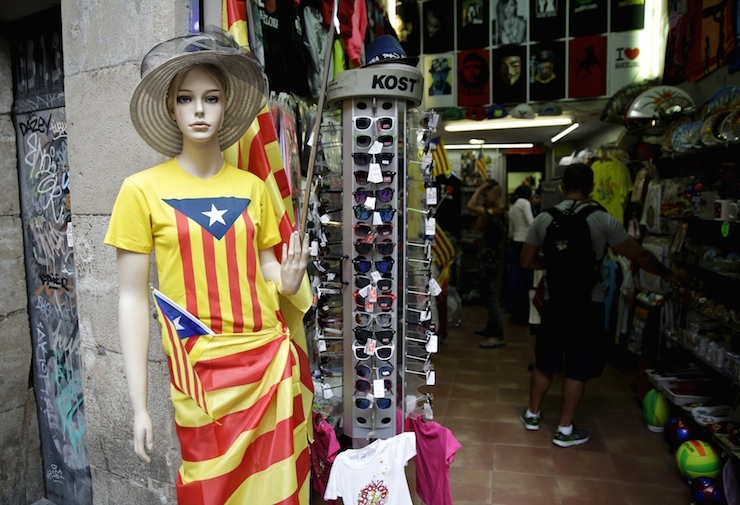 Mannequin wrapped in a "Estelada" flag, a symbol of Catalonian pro-independence, stands in front of a souvenir shop in Barcelona, Spain