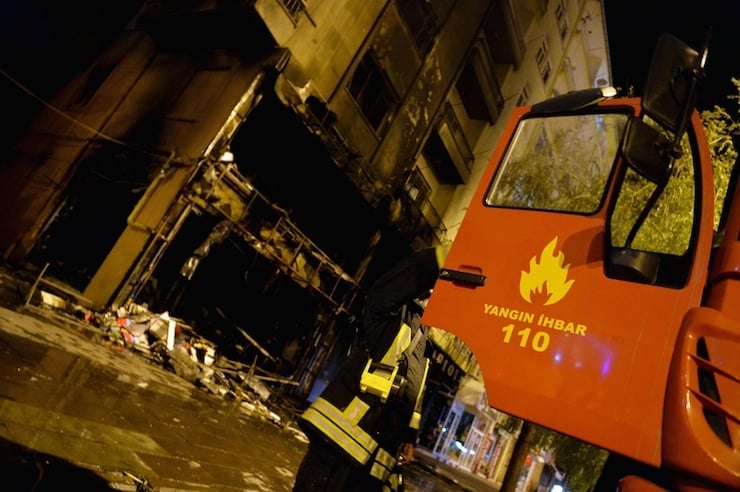 A firebrigade truck is parked outside a damaged bookstore after it was set on fire by ultra nationalist protesters in Kirsehir,Turkey