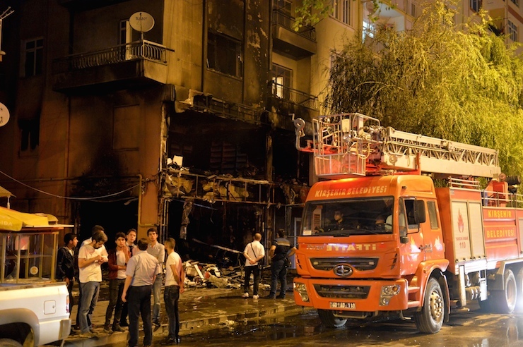 A firebrigade truck is parked outside a damaged bookstore after it was set on fire by ultra nationalist protesters in Kirsehir,Turkey