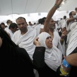 Muslim pilgrims cast stones at pillars symbolizing Satan, during the annual Haj pilgrimage on Eid al-Adha in Mina, near the holy city of Mecca