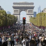 People walk on the Champs-Elysees as central Paris goes car-free