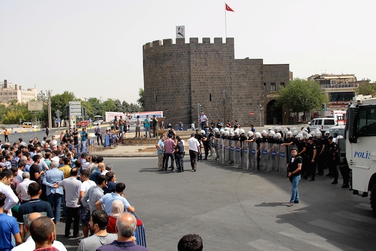 Riot police block a street to prevent people from entering the Sur district in the Kurdish dominated southeastern city of Diyarbakir, Turkey