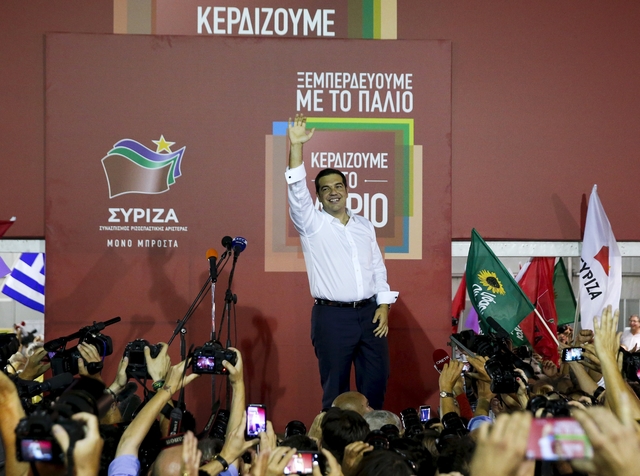 Former Greek prime minister and leader of leftist Syriza party Alexis Tsipras waves to supporters after winning general election in Athens
