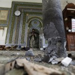 Houthi militant stands inside the al-Balili mosque after two bombings hit the mosque in Yemen's capital Sanaa