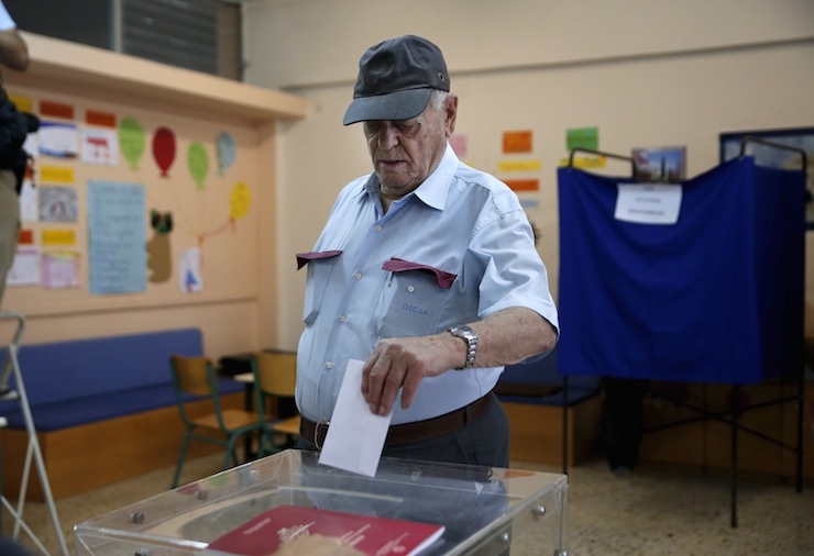 A man casts his ballot in a general election at a polling station in Athens