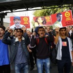 Members of the left-wing Labour Party (EMEP) carry pictures of the victims of Saturday's bomb blasts during a commemoration in Ankara