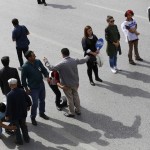 Volunteers search people before letting them enter a square during a commemoration for the victims of Saturday's bomb blasts in the Turkish capital, in Ankara, Turkey