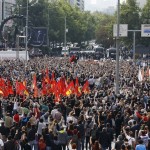 People gather in a square during a commemoration for the victims of Saturday's bomb blasts in the Turkish capital, in Ankara, Turkey