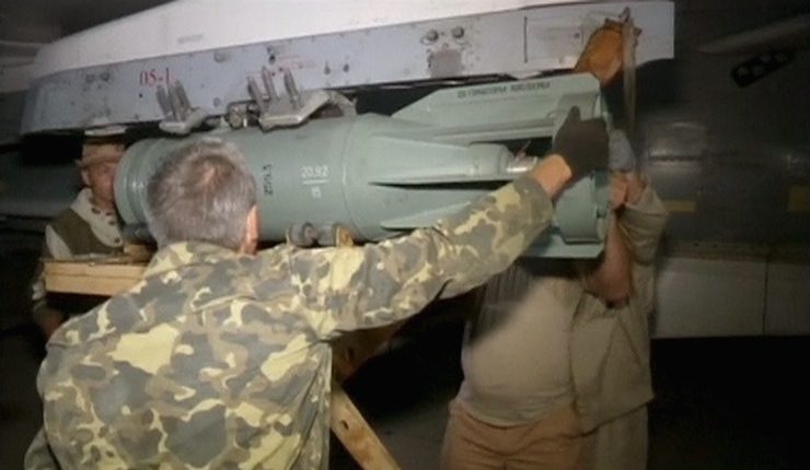A frame grab taken from footage released October 1, 2015, shows technicians servicing a Russian Military jet in Syria. Russia estimates its air strike campaign in Syria could last three to four months, the head of the foreign affairs committee at the State Duma, Russia's parliament, said on Friday. REUTERS/Reuters TV/Pool THIS IMAGE HAS BEEN SUPPLIED BY A THIRD PARTY. IT IS DISTRIBUTED, EXACTLY AS RECEIVED BY REUTERS, AS A SERVICE TO CLIENTS.