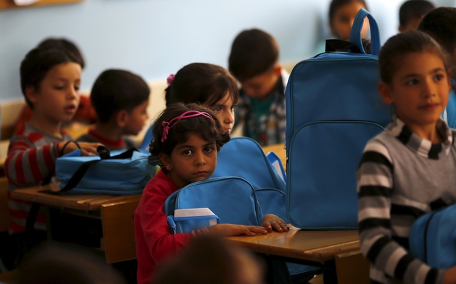 Syrian refugee children are seen during a lesson at Fatih Sultan Mehmet School in Karapurcek district of Ankara