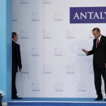 Russia's President Putin turns back to talk to Turkey's President Erdogan during welcoming ceremony at G20 summit in Antalya