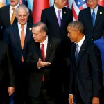 World leaders including Xi, Erdogan, Obama and Merkel participate in a family photo with fellow world leaders at the start of the G20 summit at the Regnum Carya Resort in Antalya, Turkey